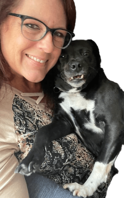 Janice Kutkus pet psychic holding black dog